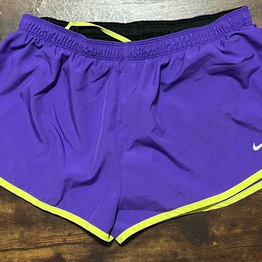 Nike Dri-Fit purple shorts with neon yellow trim 311.5